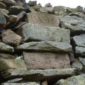 Inscribed stones on Hallin Fell summit cairn
