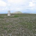 Trig point on Corserine looking towards Carlin's Cairn
